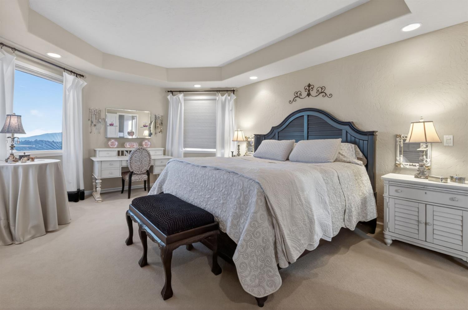 7570 Airola Road Vallecito, CA 95251 - Photo 44 of 90 a spacious bedroom with a bed and a cabinets