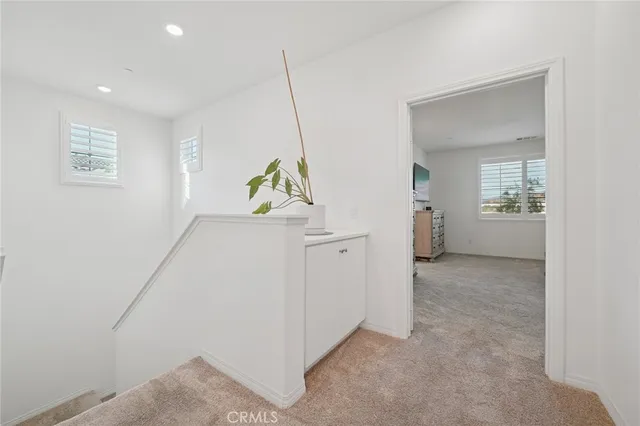 a view of hallway with livingroom