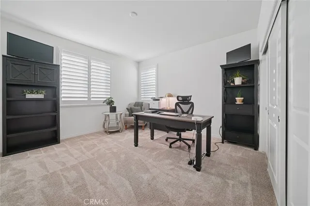 a bedroom with furniture and a window