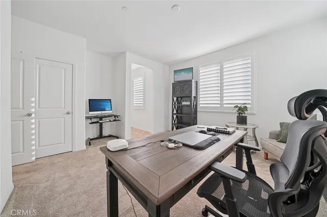 a view of a workspace with furniture