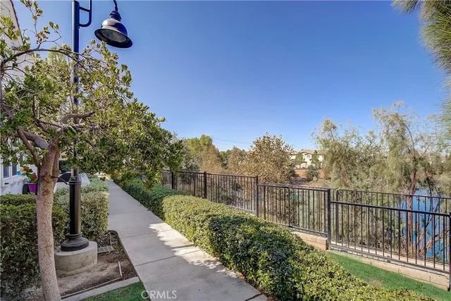 a view of a balcony with wooden fence