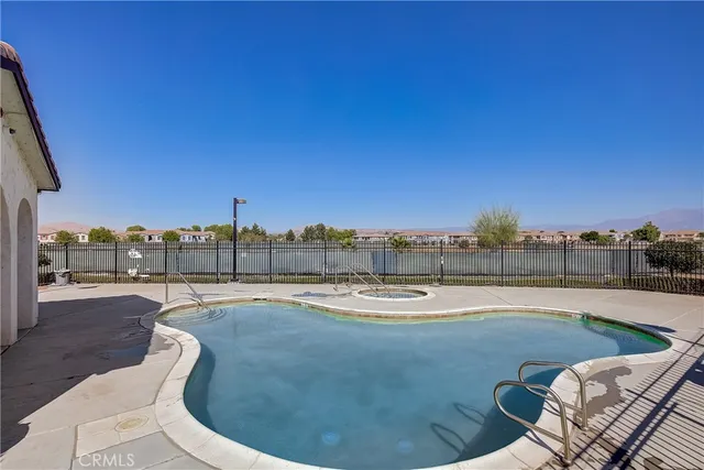 a view of a swimming pool with a lounge chair
