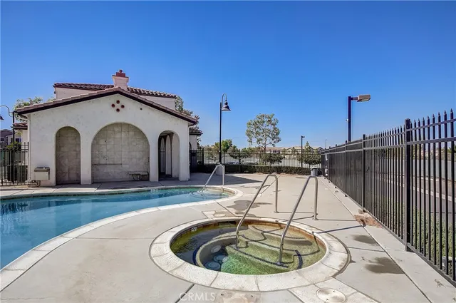 a view of a roof deck with table and chairs