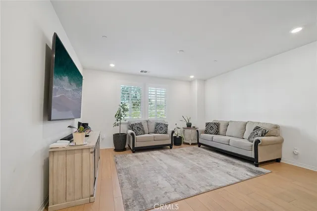 a living room with furniture window and a couch