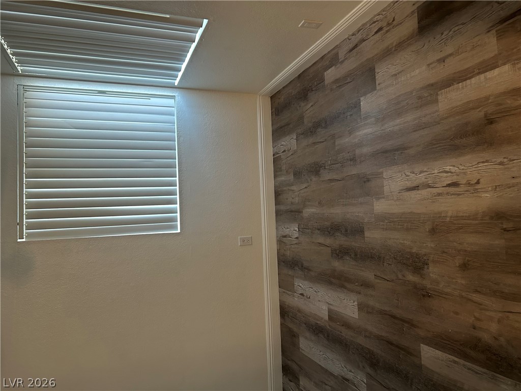 1852 North Decatur Boulevard, Unit 103 Las Vegas, NV 89108 - Photo 4 of 10 Natural light illuminates the durable wood-look flooring and clean walls of this versatile space.
