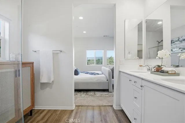 a en suite bathroom with a sink and a mirror