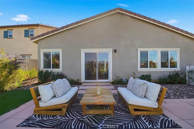 a view of a patio in back of house