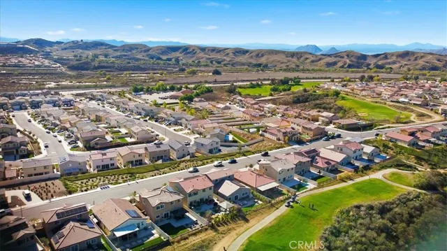 an aerial view of residential houses with outdoor space