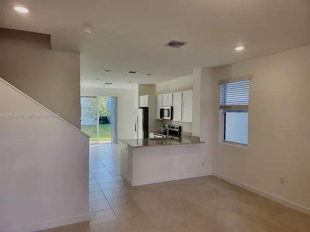 a view of a livingroom with a staircase