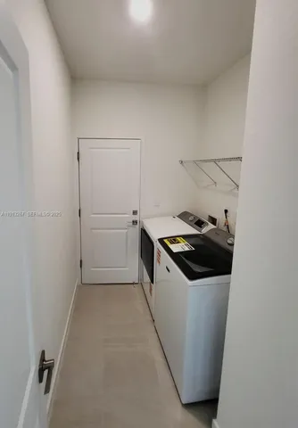 a kitchen with a cabinets and white appliances