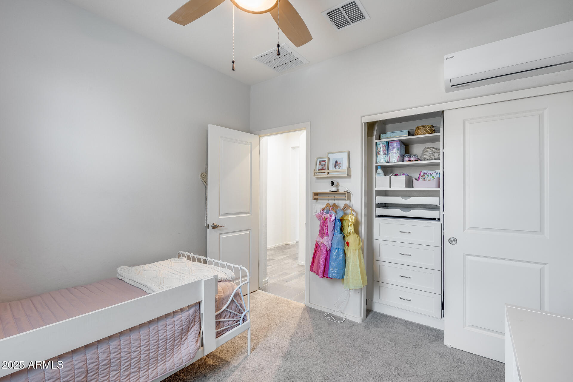 14344 West Hackamore Drive Surprise, AZ 85387 - Photo 11 of 41 a bedroom with a bed and a walk in closet