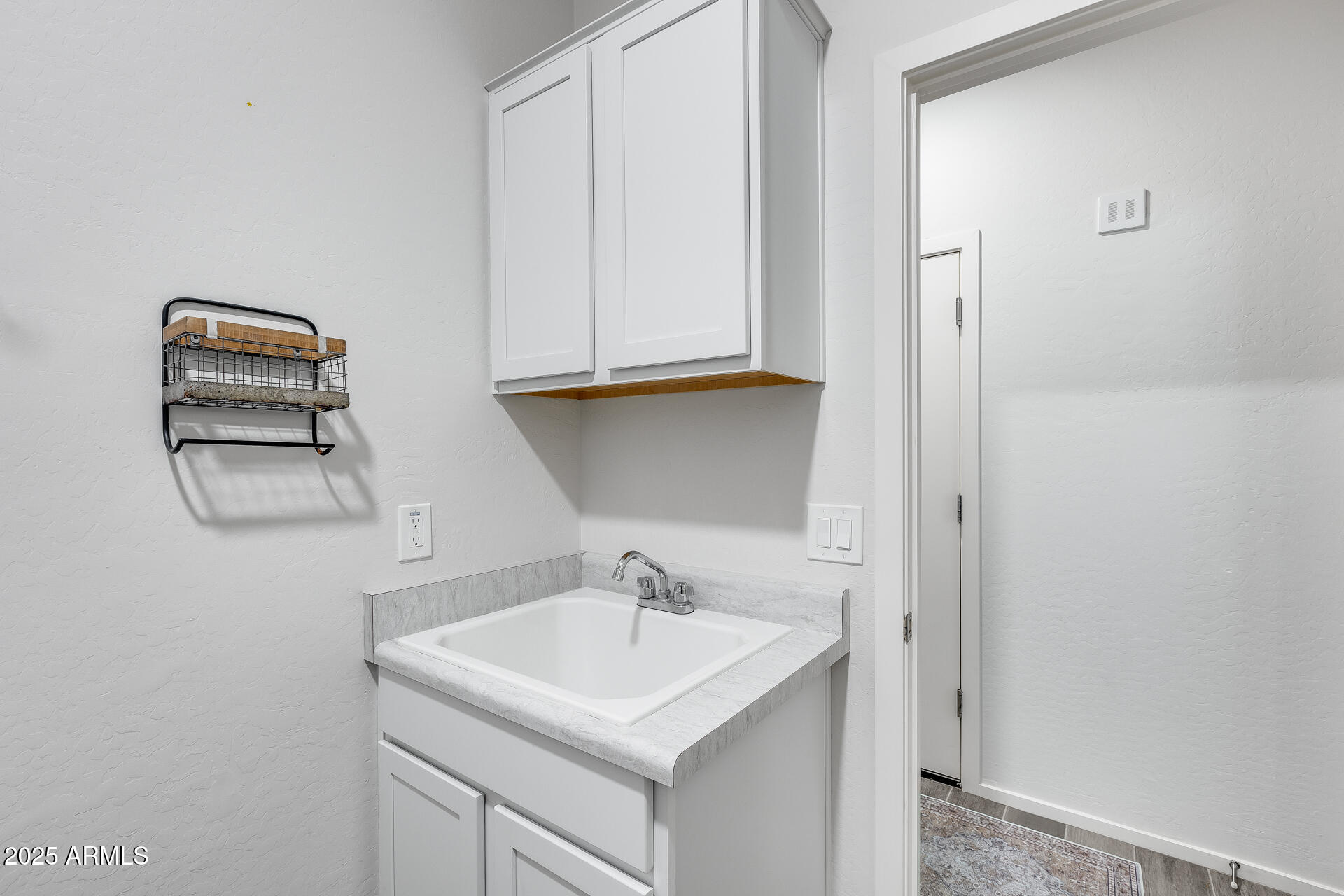 14344 West Hackamore Drive Surprise, AZ 85387 - Photo 19 of 41 a bathroom with a sink and a mirror