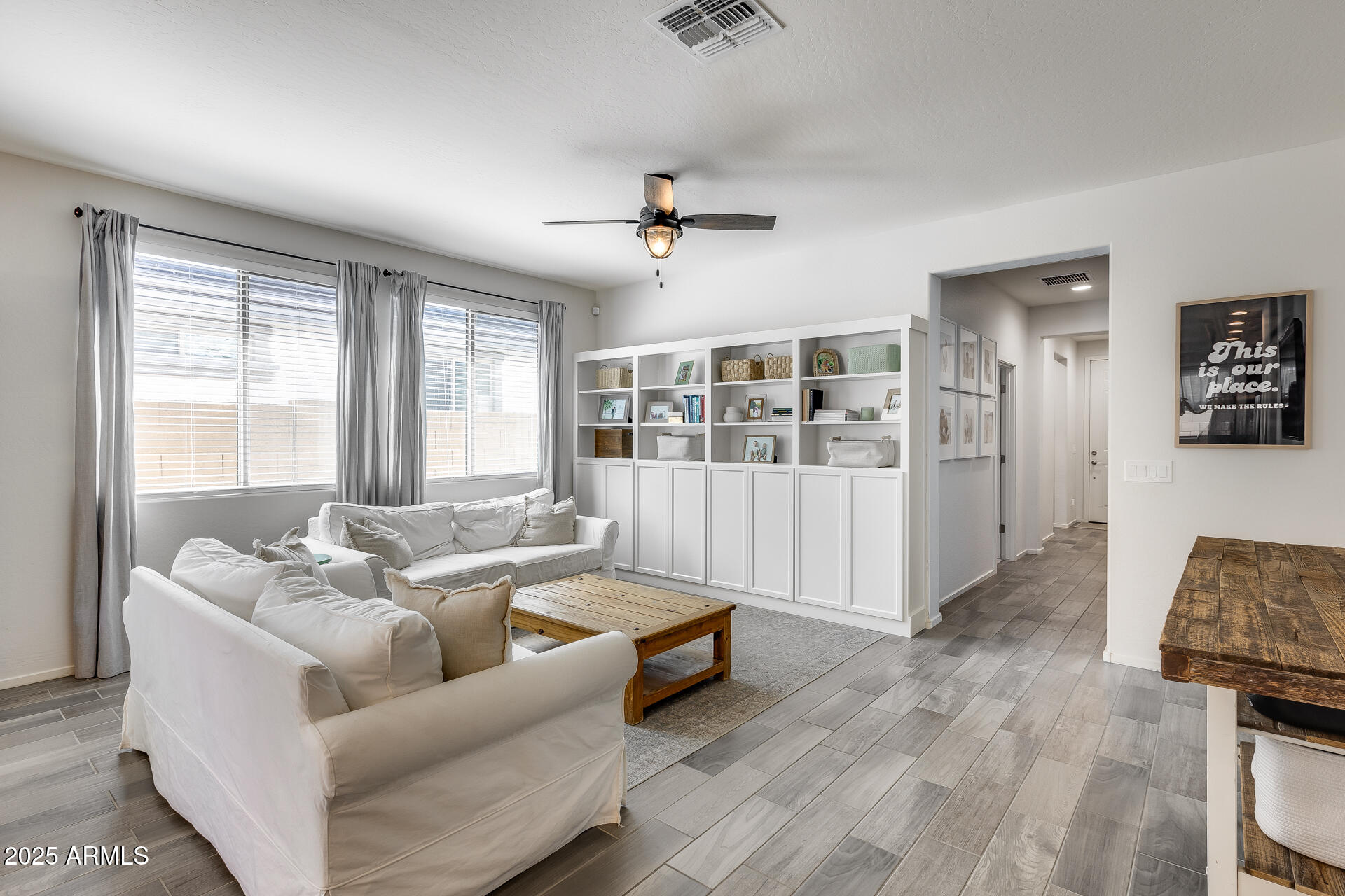 14344 West Hackamore Drive Surprise, AZ 85387 - Photo 22 of 41 a living room with furniture and windows
