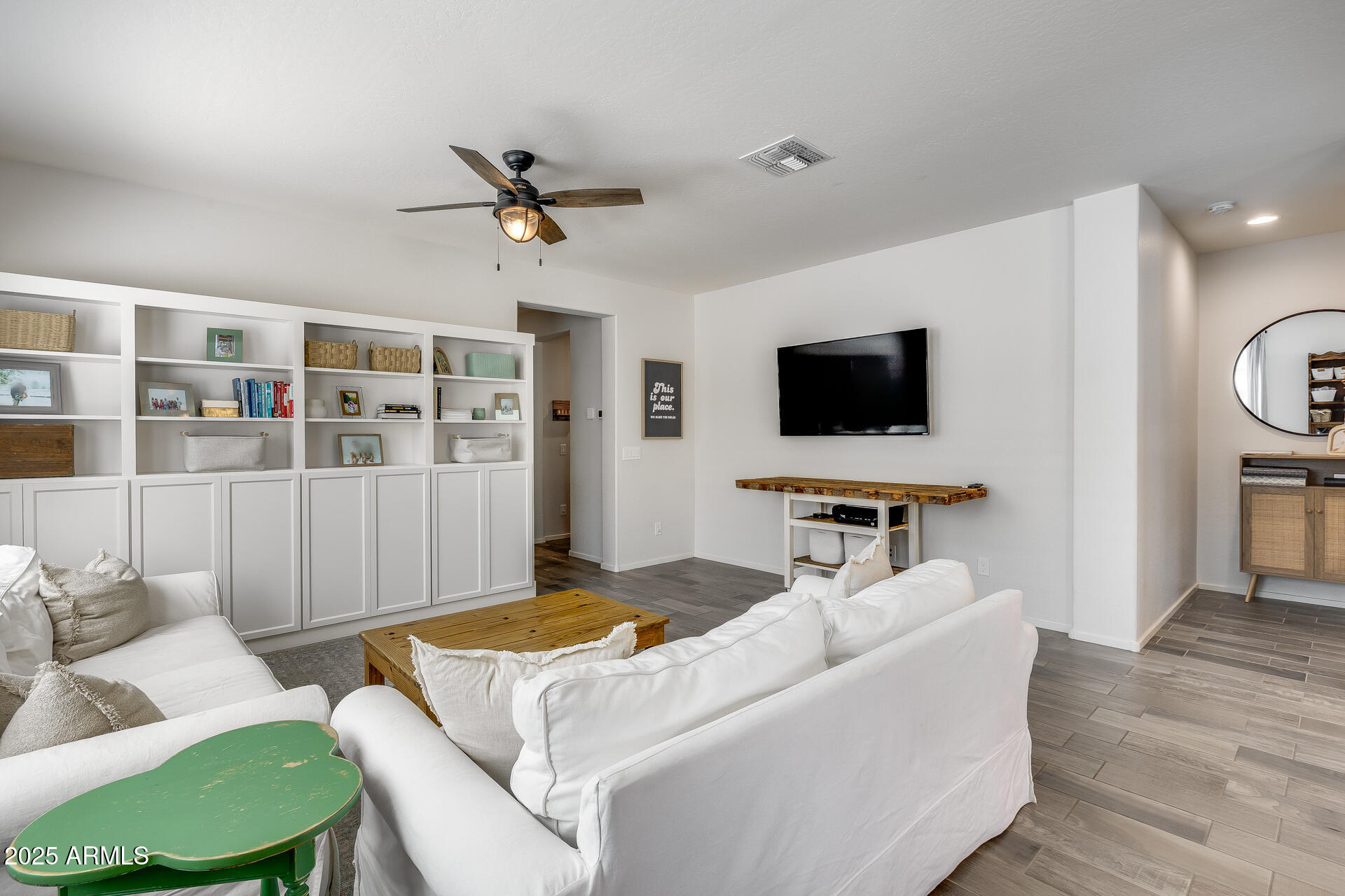 14344 West Hackamore Drive Surprise, AZ 85387 - Photo 23 of 41 a living room with furniture and a flat screen tv