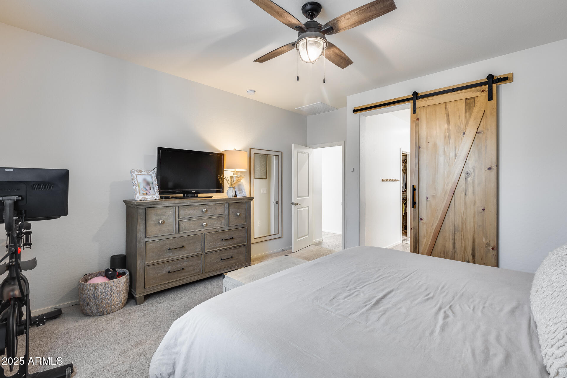 14344 West Hackamore Drive Surprise, AZ 85387 - Photo 32 of 41 a bedroom with a bed and a flat screen tv