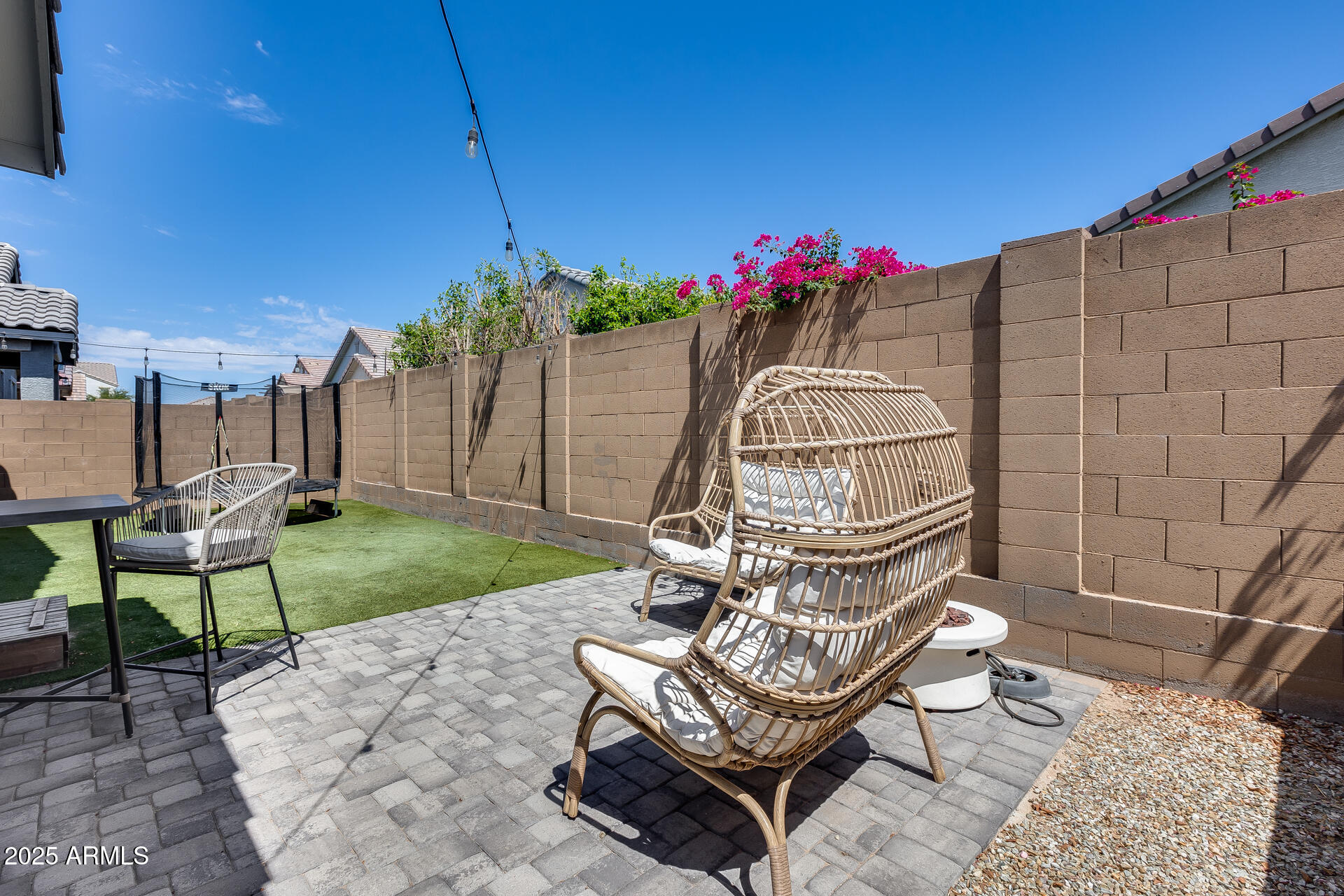 14344 West Hackamore Drive Surprise, AZ 85387 - Photo 37 of 41 a view of a chairs and table in backyard