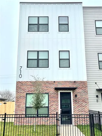 a front view of a house with a glass door