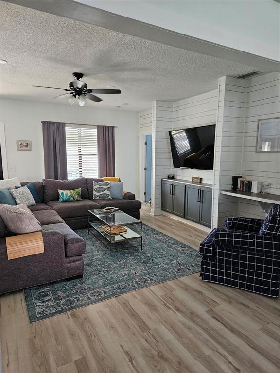 42 Menendez Road St. Augustine, FL 32080 - Photo 11 of 31 a living room with furniture and a flat screen tv