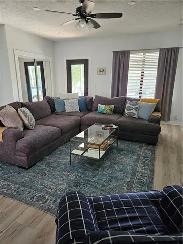 a living room with furniture and a rug