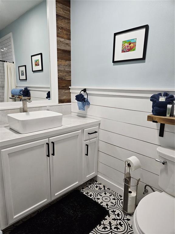 42 Menendez Road St. Augustine, FL 32080 - Photo 15 of 31 a bathroom with a sink toilet and vanity