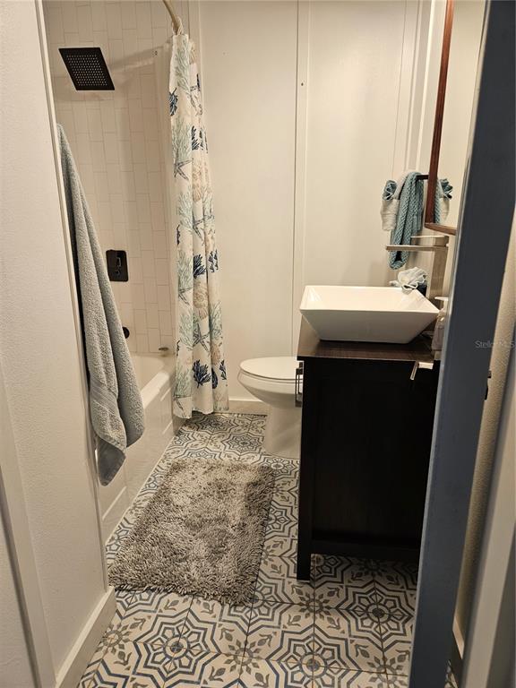 42 Menendez Road St. Augustine, FL 32080 - Photo 21 of 31 a bathroom with a sink a toilet a mirror and shower