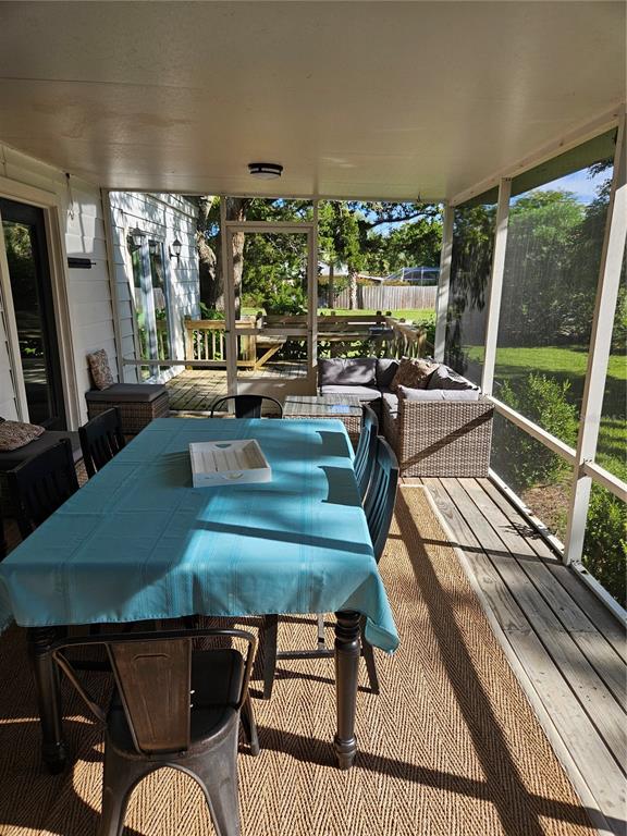 42 Menendez Road St. Augustine, FL 32080 - Photo 22 of 31 a living room with large window and a table