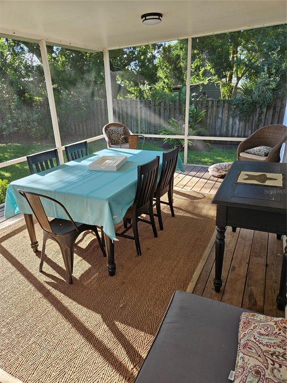 42 Menendez Road St. Augustine, FL 32080 - Photo 23 of 31 a view of a patio with a table chairs and a backyard