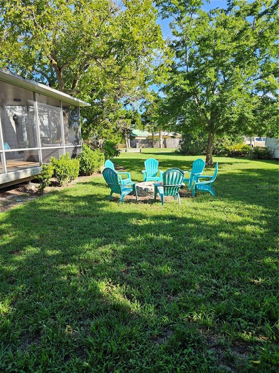 42 Menendez Road St. Augustine, FL 32080 - Photo 26 of 31 a view of a chair and table in the garden