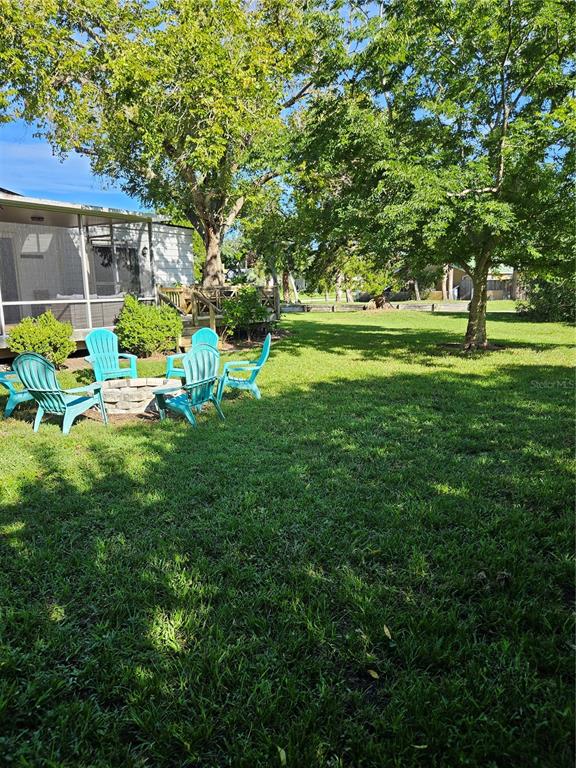 42 Menendez Road St. Augustine, FL 32080 - Photo 27 of 31 a view of a house with a big yard and sitting area