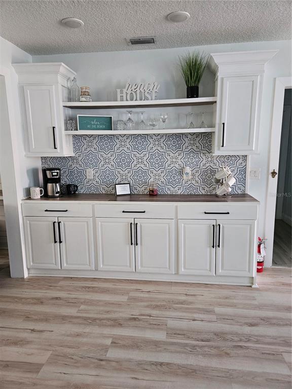 42 Menendez Road St. Augustine, FL 32080 - Photo 6 of 31 a kitchen with white cabinets and sink