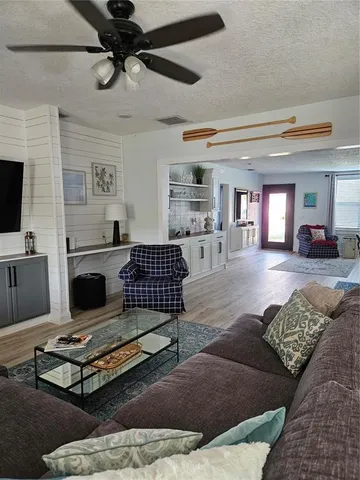a living room with furniture and a rug