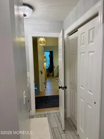 a view of a bathroom from a hallway