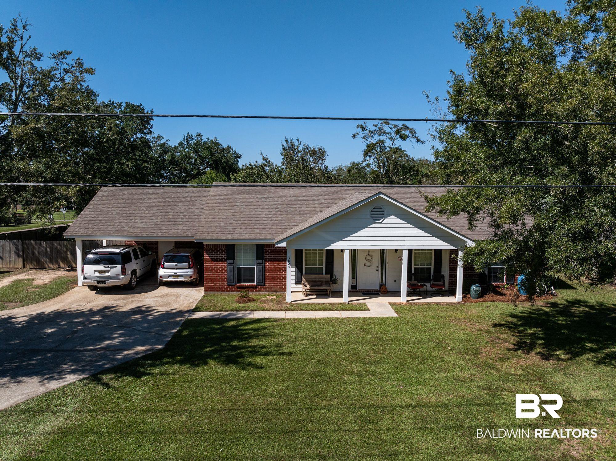 13025 County Road 55 Foley, AL 36535 - Photo 33 of 49 Single story home with a front yard, covered porch, and a carport