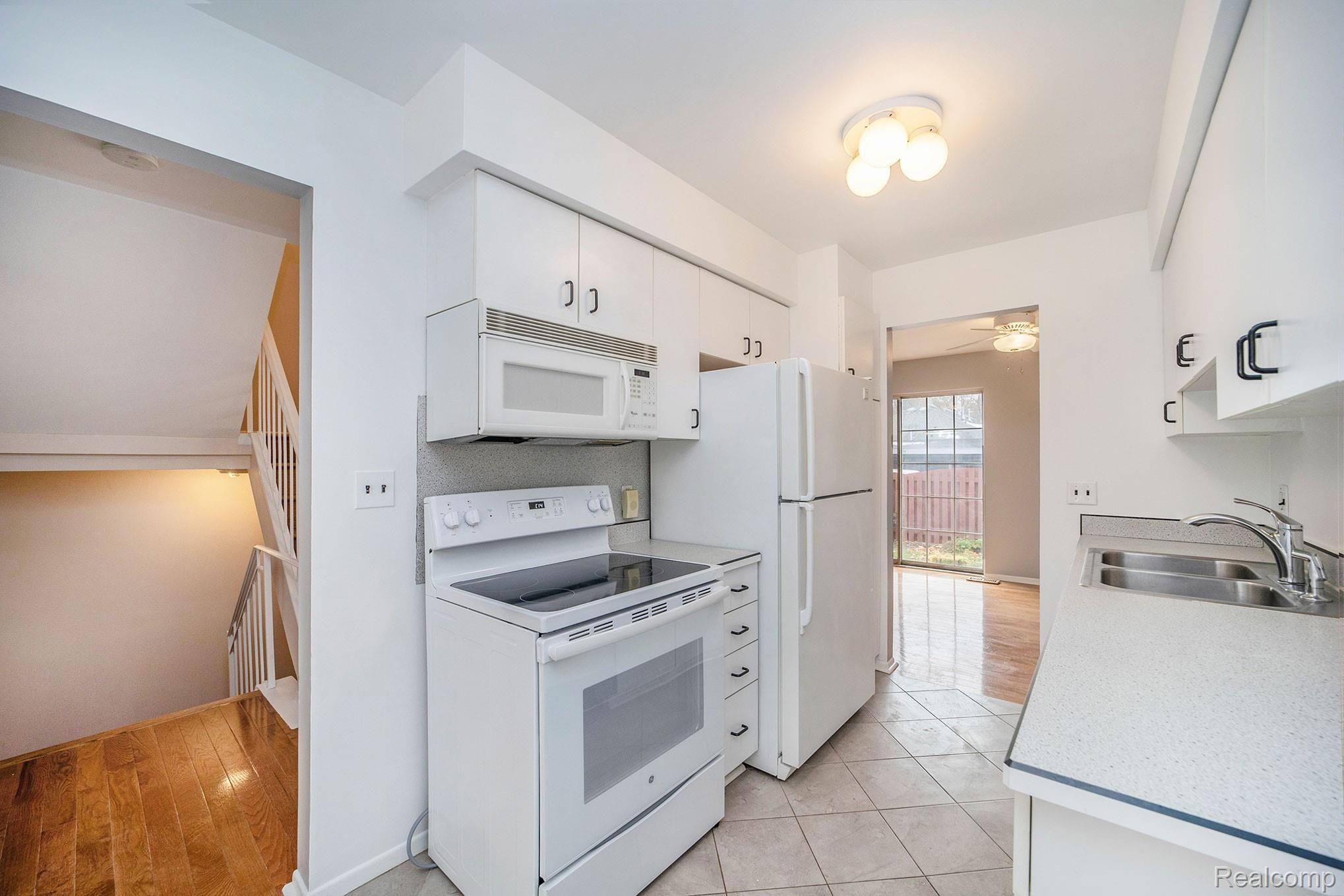3443 Crooks Road Royal Oak, MI 48073 - Photo 5 of 30 Bright kitchen with a new range, & breakfast nook overlooking the courtyard.