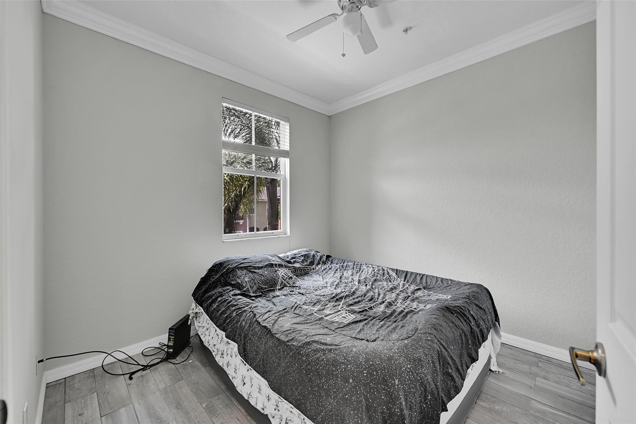 2851 Prospect Road, Unit 1202 Tamarac, FL 33309 - Photo 16 of 25 a bedroom with bed and window
