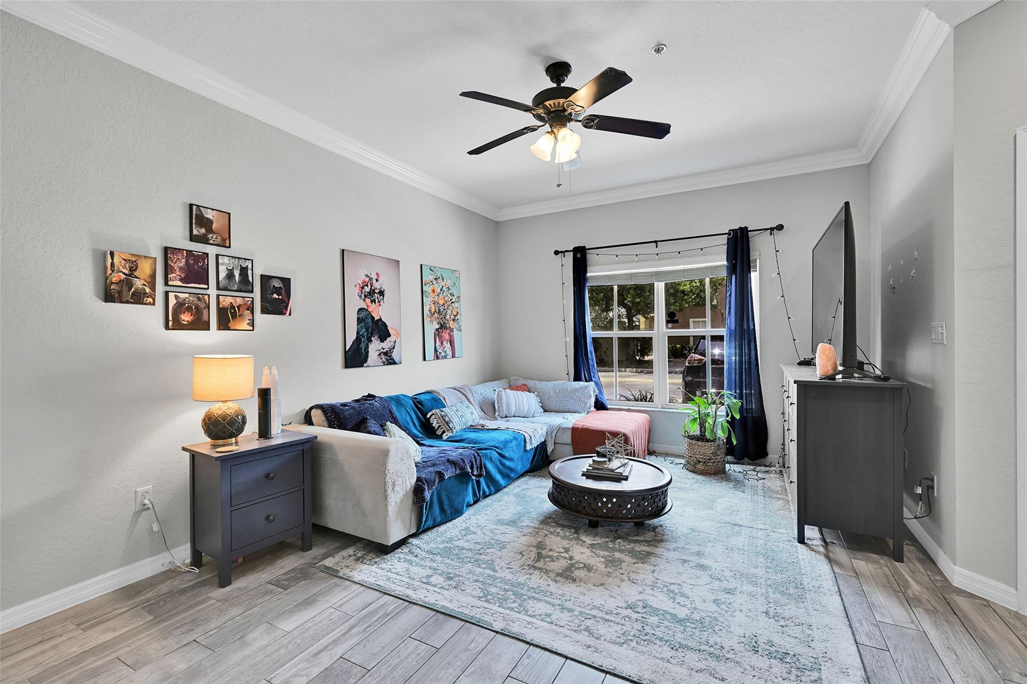 2851 Prospect Road, Unit 1202 Tamarac, FL 33309 - Photo 5 of 25 a living room with furniture and a large window