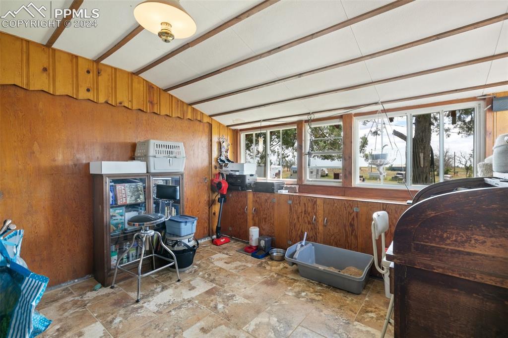 40150 Rapp Road Rush, CO 80833 - Photo 23 of 39 a living room with furniture and a floor to ceiling window