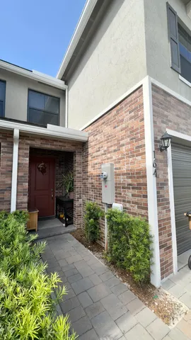 a view of a building with potted plants