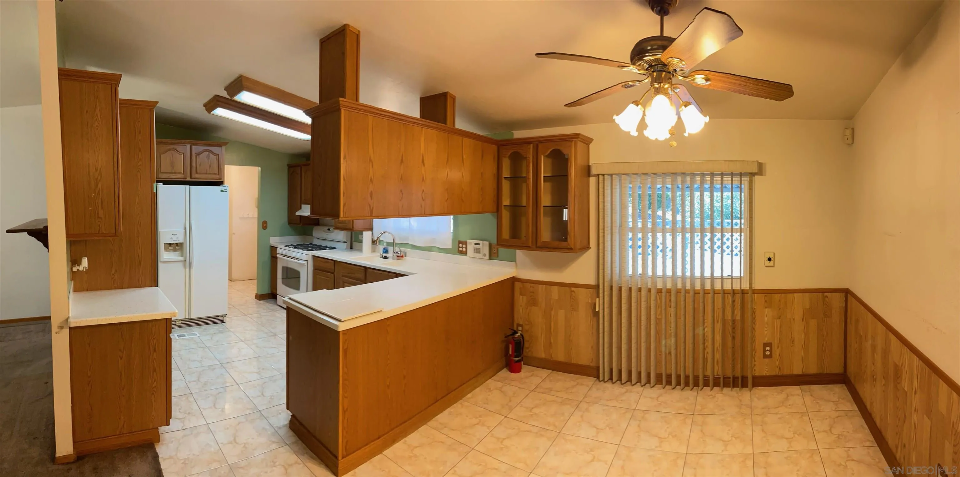 250 La Cresta Heights Road, Unit 18 El Cajon, CA 92021 - Photo 11 of 26 a kitchen that has a lot of cabinets and wooden floor