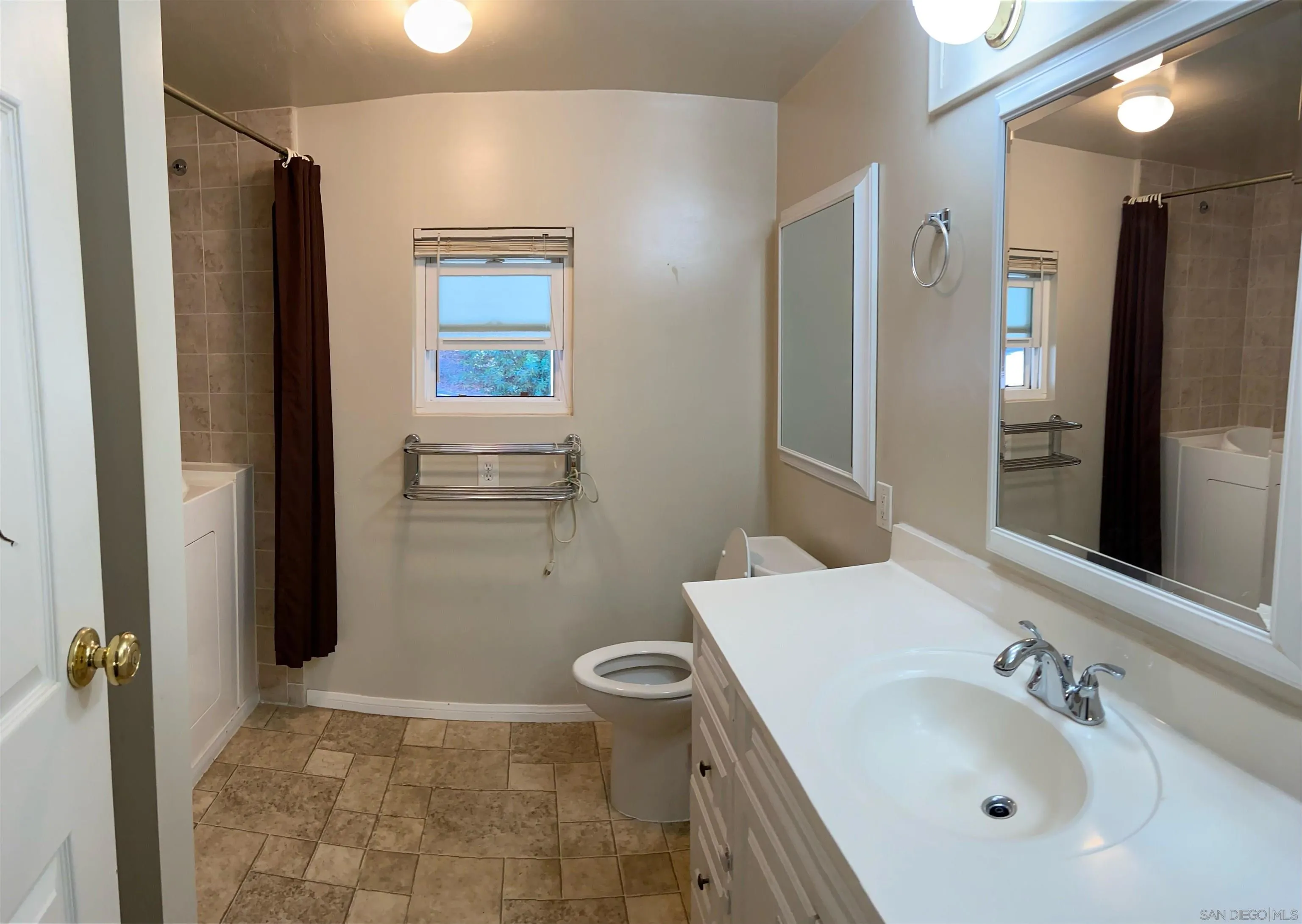 250 La Cresta Heights Road, Unit 18 El Cajon, CA 92021 - Photo 17 of 26 a bathroom with a sink a toilet and shower