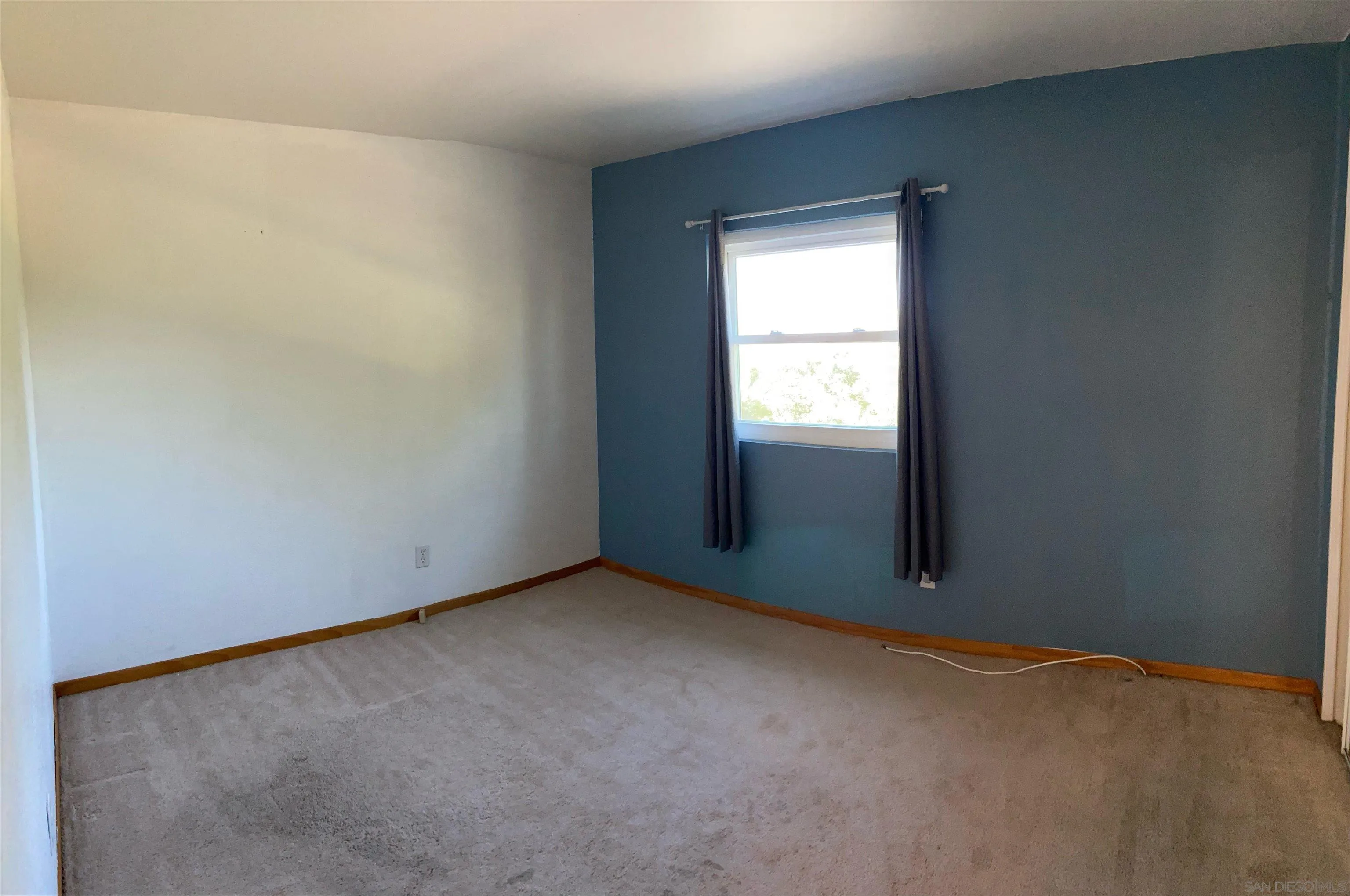 250 La Cresta Heights Road, Unit 18 El Cajon, CA 92021 - Photo 20 of 26 an empty room with a window