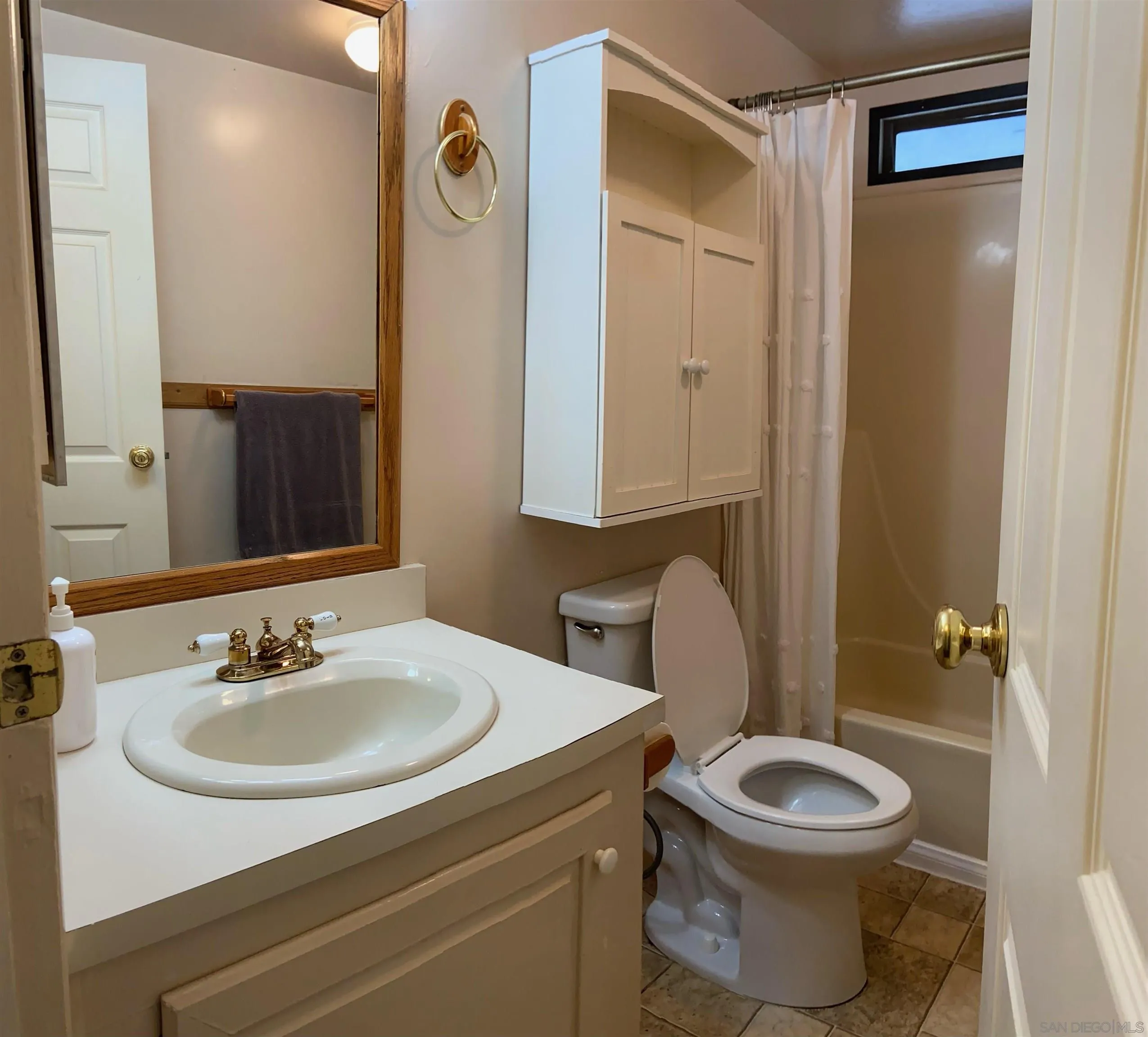 250 La Cresta Heights Road, Unit 18 El Cajon, CA 92021 - Photo 21 of 26 a bathroom with a granite countertop toilet sink and mirror