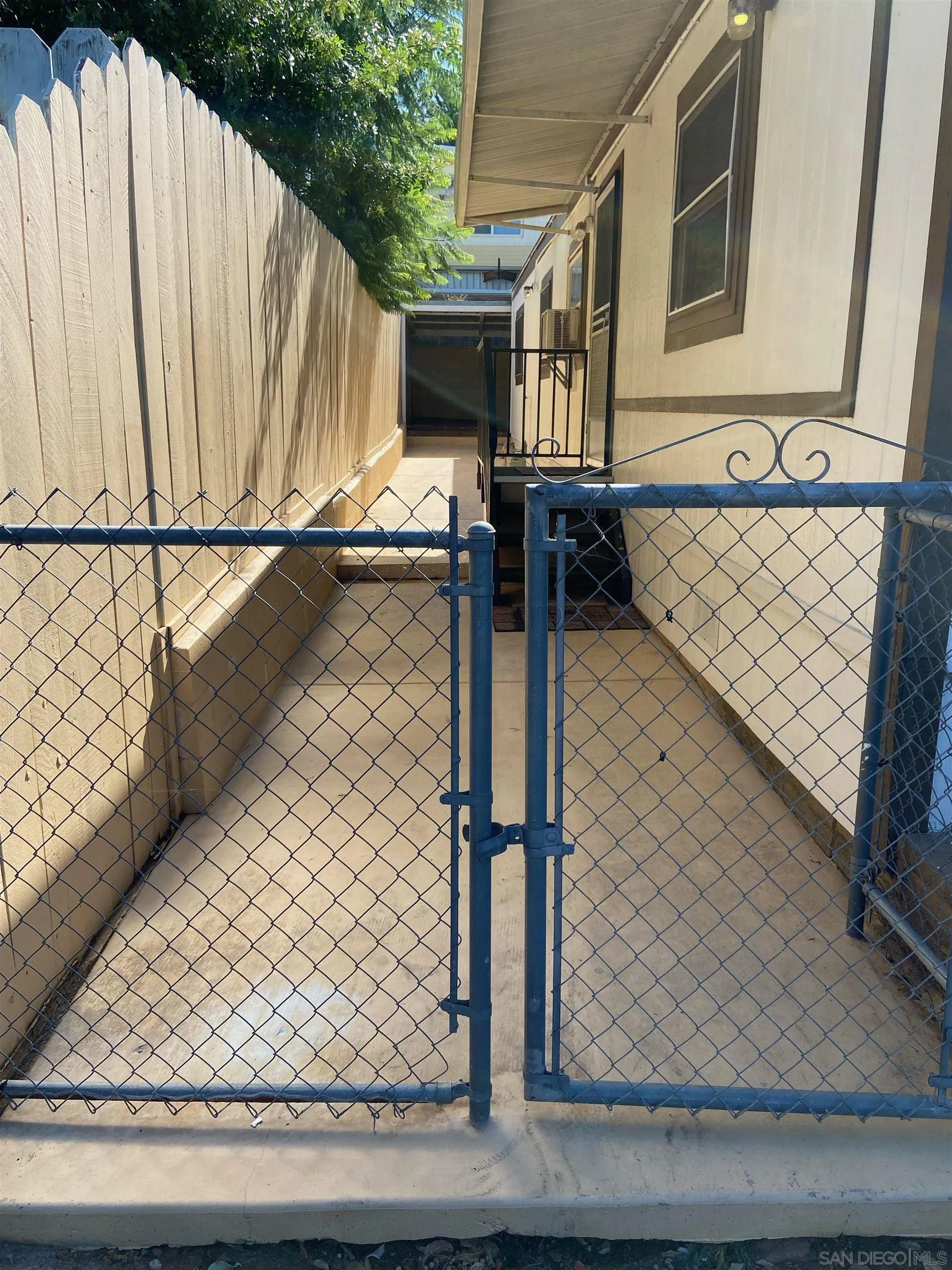 250 La Cresta Heights Road, Unit 18 El Cajon, CA 92021 - Photo 5 of 26 a view of a balcony with wooden floor and fence
