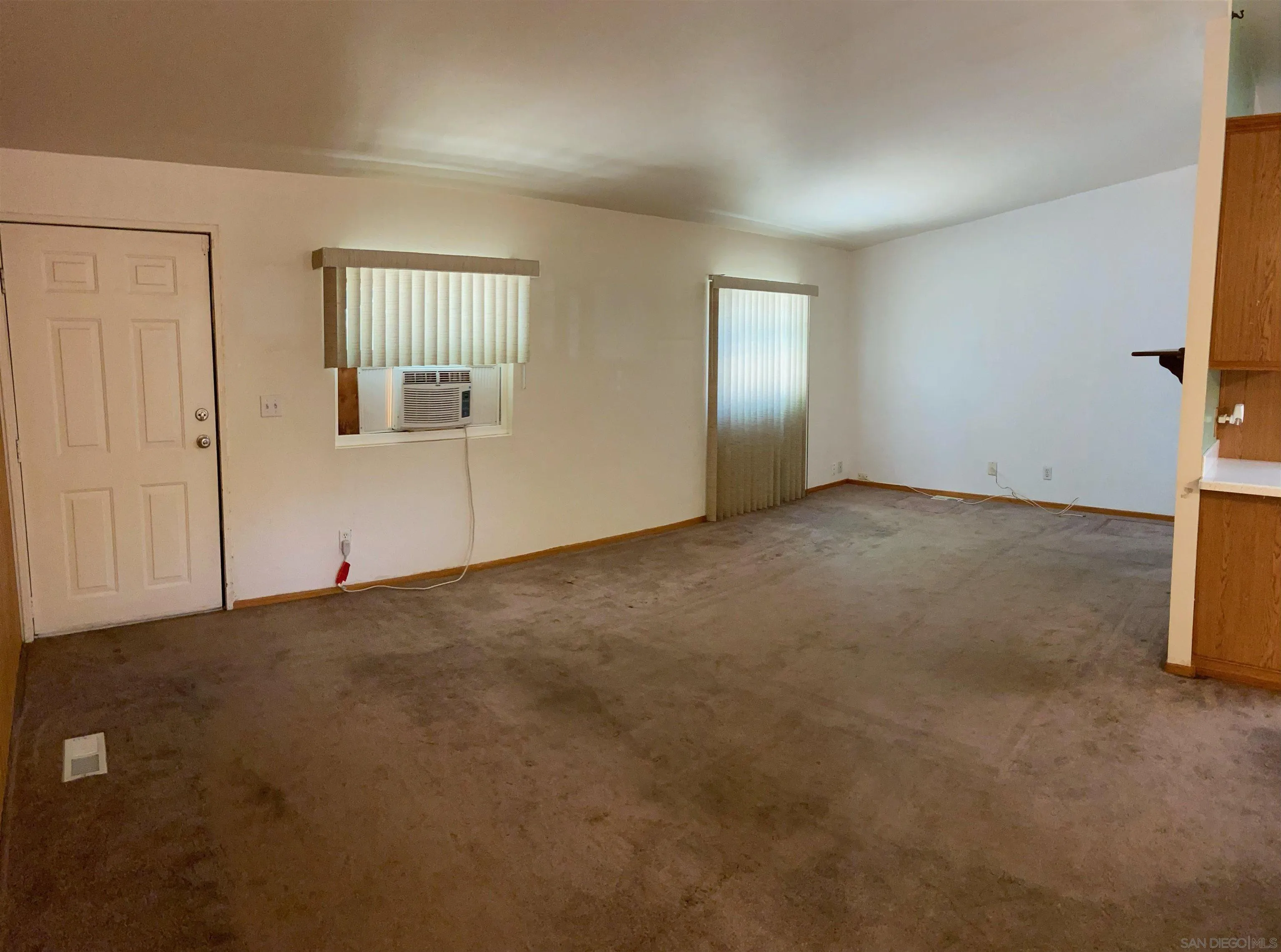 250 La Cresta Heights Road, Unit 18 El Cajon, CA 92021 - Photo 10 of 26 an empty room with windows