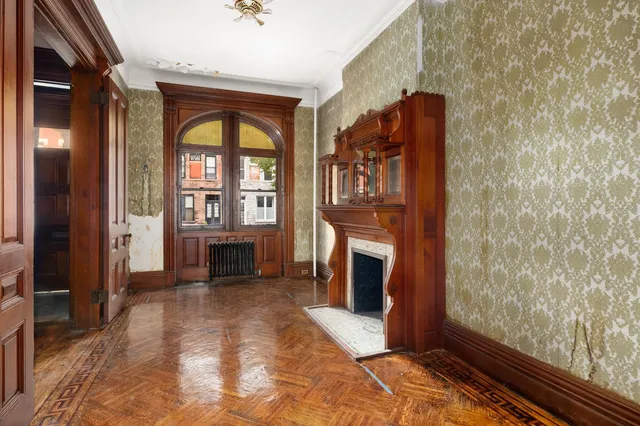 a view of a brick building next to a yard