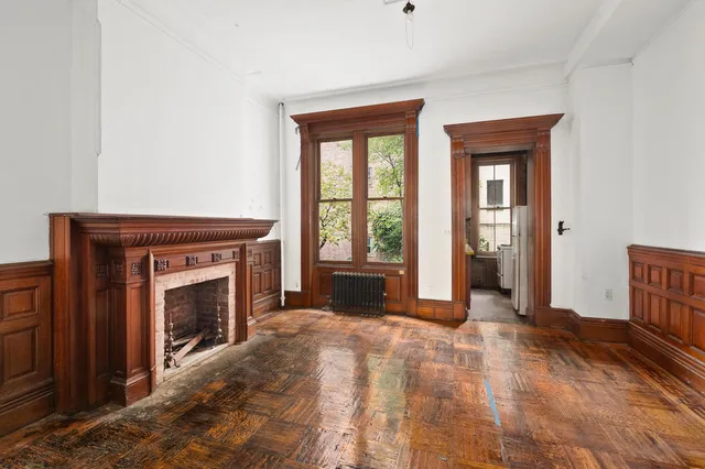 a view of fireplace and wooden floor