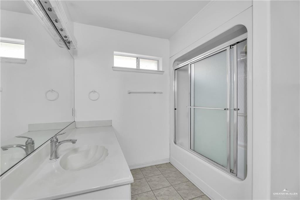 2002 Meadow Way Drive Mission, TX 78572 - Photo 15 of 20 a bathroom with a sink and shower