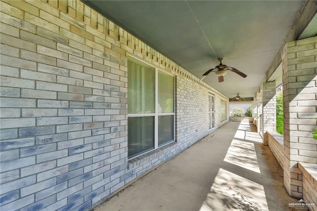 2002 Meadow Way Drive Mission, TX 78572 - Photo 16 of 20 a view of a pathway with a brick wall