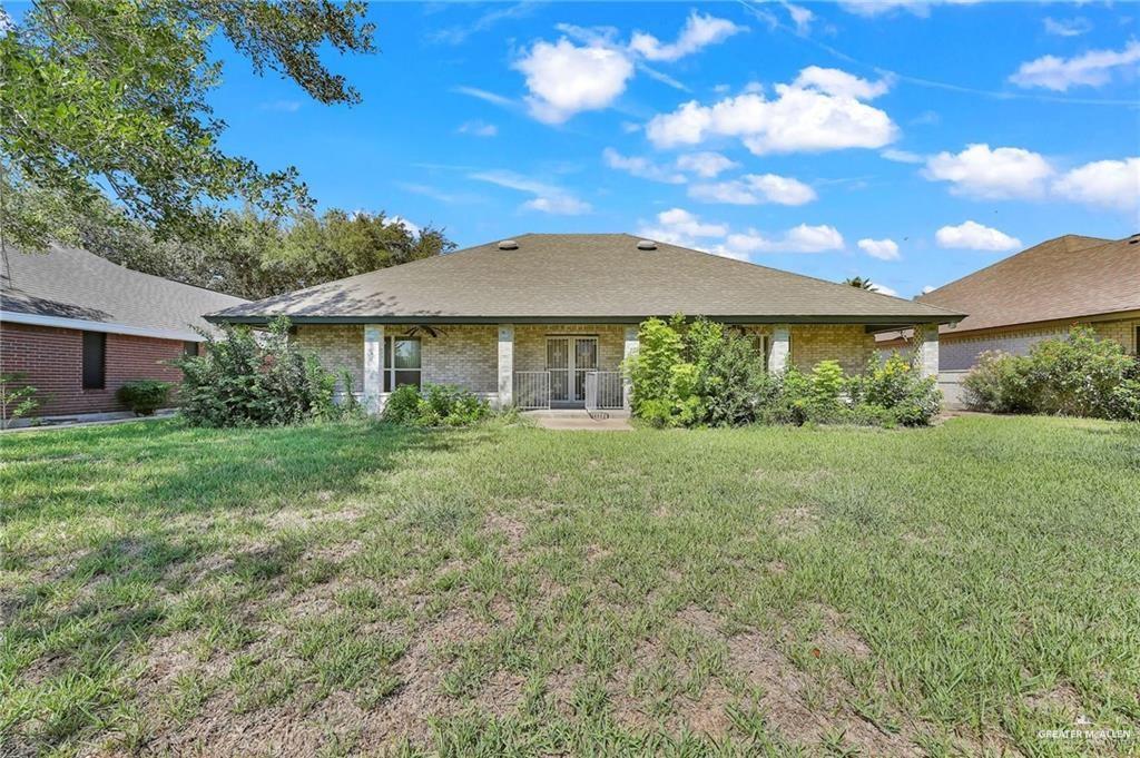 2002 Meadow Way Drive Mission, TX 78572 - Photo 19 of 20 a front view of a house with garden