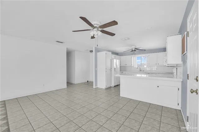 a view of a kitchen with a sink